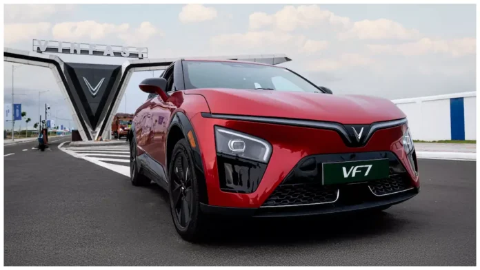 VinFast electric car charging at public station with free charging offer announcement till 2029